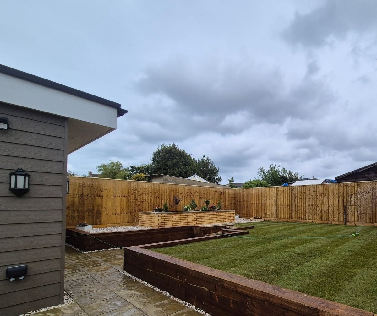 Completed — patio area with raised beds and fencing