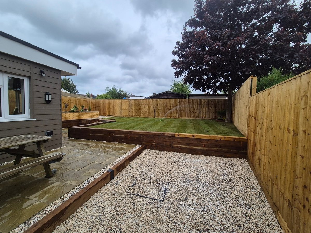 Nearly finished — raised garden beds and gravel patio installed